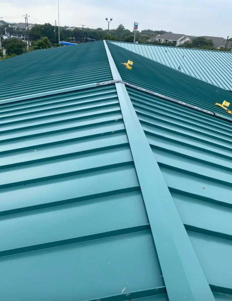Green commercial metal roof ridge and valley for Metal Roof Repair in Saddlebrooke
